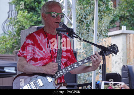 Los Angeles, CA / USA - July 22, 2018: Robby Krieger, original guitarist for The Doors, performs at the 6th annual Love Street Festival in the Laurel Canyon section of the city. Singer Jim Morrison wrote the lyrics to the song 'Love Street' about the area and, commemorating the 50th anniversary of the song's release, the city of L.A. renamed a portion of the street Morrison lived on in the 1960s, Rothdell Trail, to Love Street. Stock Photo