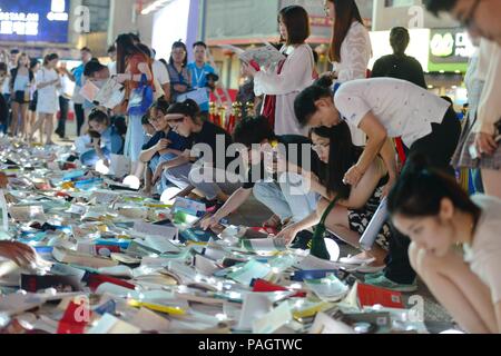 Nanjin, Nanjin, China. 23rd July, 2018. Nanjing, CHINA-Citizens get free luminous books at a campaign in Nanjing, east China's Jiangsu Province. The campaign appeals the public to spend more time in reading. Credit: SIPA Asia/ZUMA Wire/Alamy Live News Stock Photo
