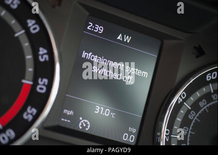 London, UK. 23 July, 2018. Hot, dry weather continues in London with more humid nights and high daytime temperatures forecast. A car temperature gauge reads 31 degrees outside temperature in south west London at mid-day. Credit: Malcolm Park/Alamy Live News. Stock Photo
