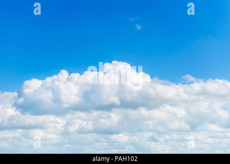 Amazing White Fluffy Clouds on Bright Blue Sky Stock Photo
