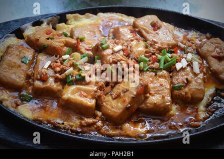 Hairy tofu is popular and delicious dish of Anhui province in China. It is one kind of fermented tofu, there is a growth of hairy-like mould on it. Stock Photo