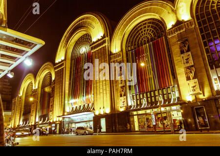 BUENOS AIRES, ARGENTINA - SEPTEMBER 20: Corrientes Street by night. Abasto building facade at Buenos Aires, Argentina.  Vintage and yesteryear effect Stock Photo