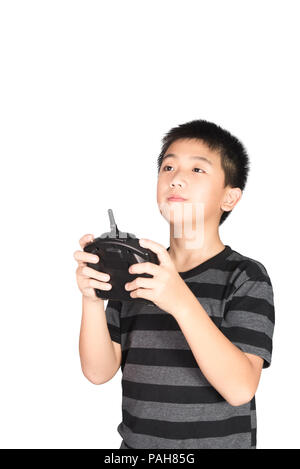 Asian boy holding hexacopter drone and radio remote control (controlling handset) for helicopter, drone or plane, studio shot isolated on white backgr Stock Photo