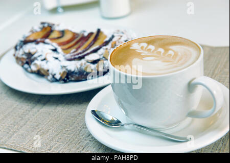 cappuccino and cake on the table Stock Photo