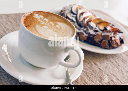 cappuccino and cake on the table Stock Photo