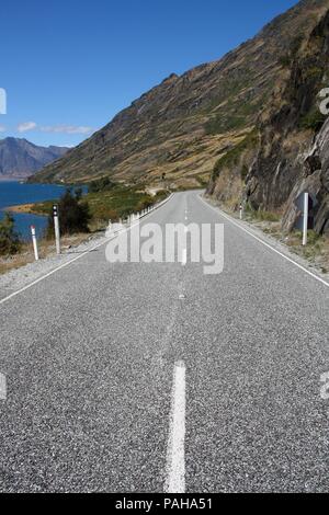 Road along Lake Hawea - beautiful landscape in Otago region, New Zealand Stock Photo