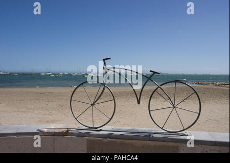 bicycle mounted on a wall in Spain Stock Photo