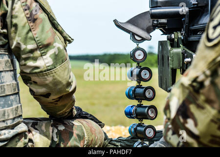 Mark 19 40 mm grenade machine amunition locked and loaded  during Operation Cold Steel II hosted by US Army Civil Affairs and Psychological Operations Command (Airborne), July 13, 2018 at Joint Base McGuire- Dix-Lakehurst, NJ. Operation Cold Steel is the U.S. Army Reserve's crew-served weapons qualification and validation exercise to ensure America's Army Reserve units and Soldiers are trained and ready to deploy on short notice as part of Ready Force X and bring combat-ready and lethal firepower in support of the Army and our joint partners anywhere around the world. (U.S. Army Reserve photo  Stock Photo