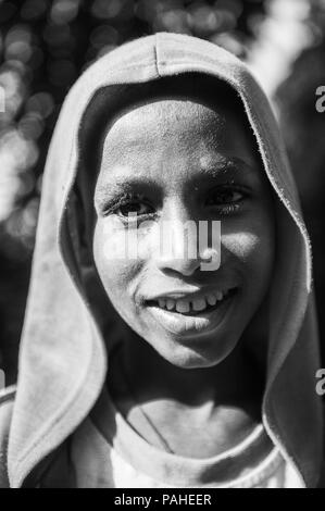 ETHIOPIA - SEPTEMBER 20, 2011: Portrait of an unidentified Ethiopian boy wearing an orange towel in Ethiopia, Sep.20, 2011. People in Ethiopia suffer  Stock Photo