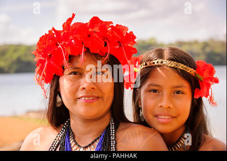EMBERA VILLAGE, PANAMA, JANUARY 9, 2012: Portrait of an unidentified native Indian woman and her daughter in Panama, Jan 9, 2012. Indian reservation i Stock Photo