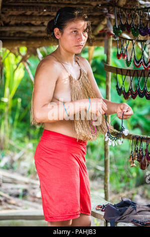 AMAZONIA, PERU - NOV 10, 2010: Unidentified Amazonian indigenous woman. Indigenous people of Amazonia are protected by  COICA (Coordinator of Indigeno Stock Photo