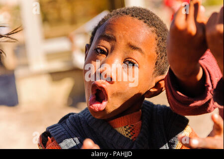 ANTANANARIVO, MADAGASCAR - JUNE 27, 2011: Unidentified Madagascar man smiles and poses for camera. People in Madagascar suffer of poverty due to the s Stock Photo