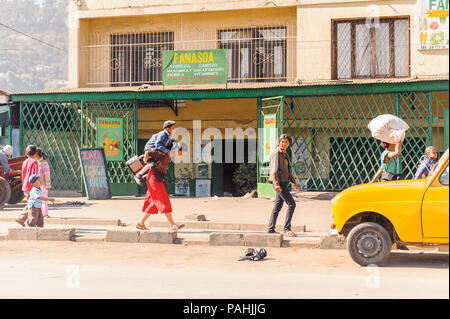 ANTANANARIVO, MADAGASCAR - JUNE 27, 2011: Unidentified Madagascarpeople in the street doing different stuff. People in Madagascar suffer of poverty du Stock Photo