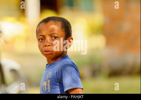 ANTANANARIVO, MADAGASCAR - JUNE 27, 2011: Unidentified Madagascar beautiful boy cries. People in Madagascar suffer of poverty due to the slow developm Stock Photo