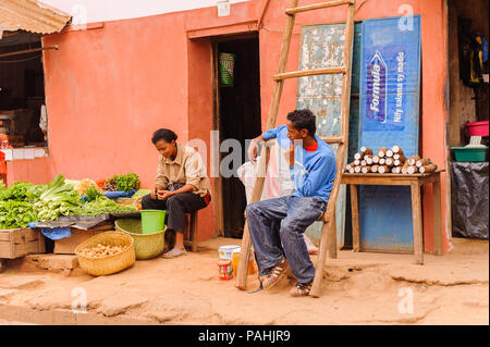 ANTANANARIVO, MADAGASCAR - JUNE 29, 2011: Unidentified Madagascar man and woman work at the market. People in Madagascar suffer of poverty due to the  Stock Photo