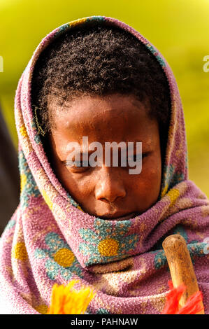 OMO VALLEY, ETHIOPIA - SEP 22, 2011: Unidentified Ethiopian little boy wearing old clothes in Ethiopia, Sep.22, 2011. Children in Ethiopia suffer of p Stock Photo