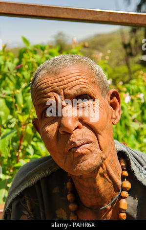 AKSUM, ETHIOPIA - SEP 28, 2011: Portrait of an unidentified Ethiopian woman with beads in Ethiopia, Sep.28, 2011. People in Ethiopia suffer of poverty Stock Photo