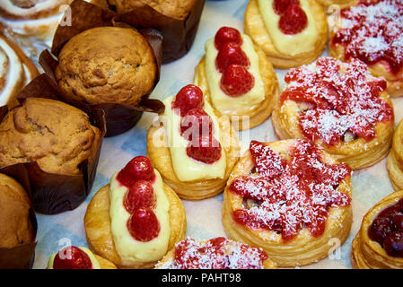 Delicious appetizing cakes on the showcase close up. Stock Photo
