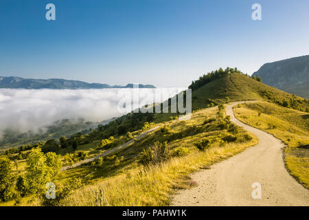 Beautiful and secluded landscape on a misty morning in the Apuseni Mountains near Salciua, Romania. Stock Photo