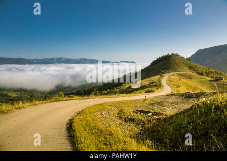 Beautiful and secluded landscape on a misty morning in the Apuseni Mountains near Salciua, Romania. Stock Photo