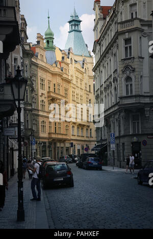 Prague, Czech, Republic - Jun 10, 2018 - A street in old town district of Prague, Czech Republic with colorful domes and buildings. Stock Photo