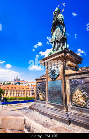 Prague, Czech Republic. Saint Augustine statue on Charles Bridge (Karluv Most), landmark of Bohemia capital city. Stock Photo