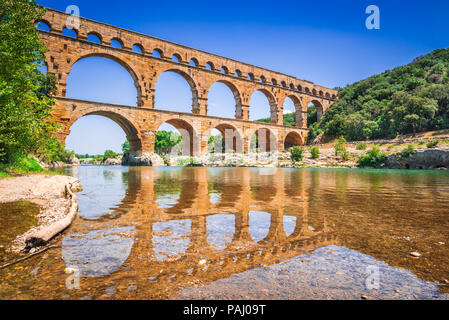 Pont du Gard three-tiered aqueduct was built in Roman times on the river Gardon. Provence summer day. Stock Photo