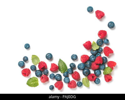 Various fresh summer berries background with copy space for text.Creative layout of fresh blueberries, raspberries and mint leaves, isolated on white background with clipping path.Top view or flat lay Stock Photo