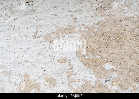 Background of an old cracked white cement wall Stock Photo