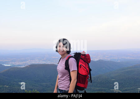 happy hiker woman to get to the top Stock Photo
