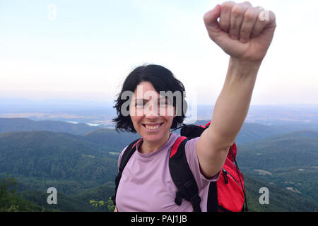 happy hiker woman to get to the top Stock Photo