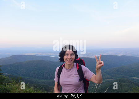 happy hiker woman to get to the top Stock Photo