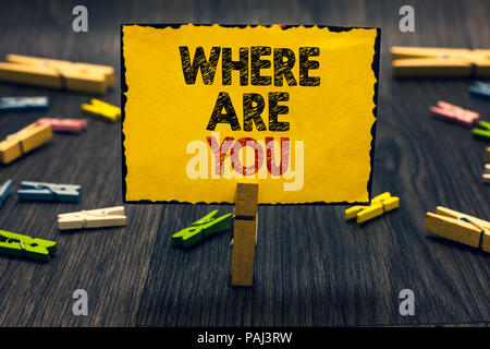 Word writing text Where Are You. Business concept for Give us your location address direction point of reference Blacky wooden desk laid paper clip ra Stock Photo