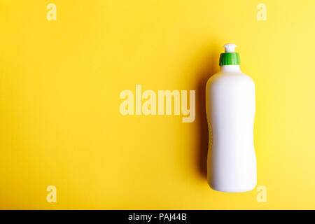Detergent on a yellow background, space for text Stock Photo