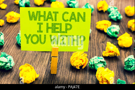 Handwriting text What Can I Help You With question. Concept meaning Offering assistance Experts advice ideas Paperclip retain written words yellow pap Stock Photo