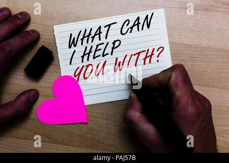 Handwriting text writing What Can I Help You With question. Concept meaning Offering assistance Experts advice ideas Written on notepad hand hold mark Stock Photo