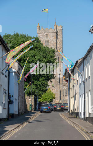Moretonhampstead small town in the Dartmoor National Park, Devon, England, UK. The church of St Andrew on a narrow street. Stock Photo