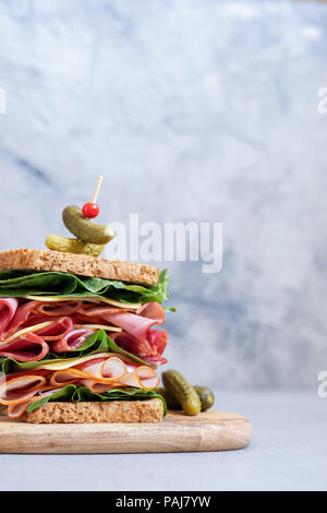 Big sandwich with ham, deli meat and vegetables Stock Photo