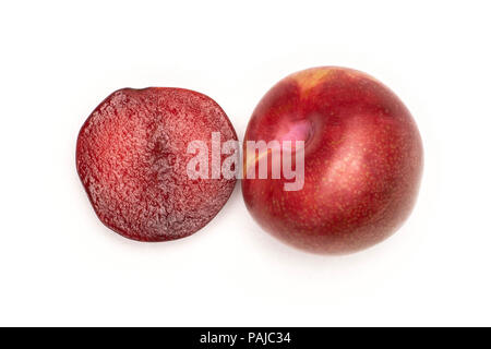 Group of one whole one half of fresh pluot interspecific plums variety flatlay isolated on white Stock Photo