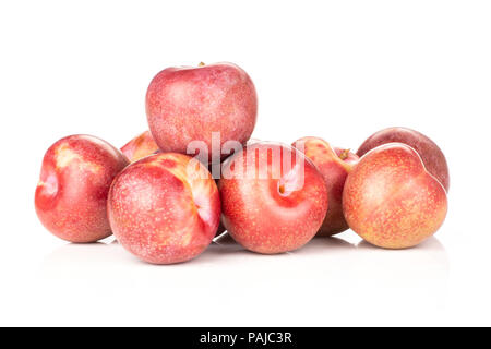 Lot of whole fresh pluot interspecific plums variety stack isolated on white Stock Photo