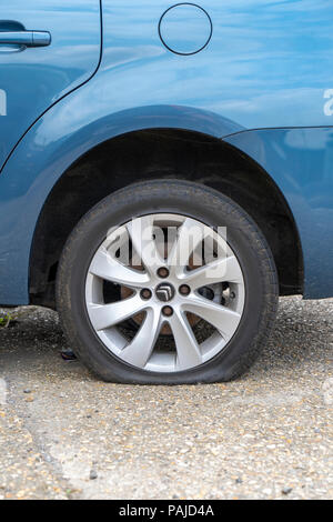 Car with flat tyre Stock Photo