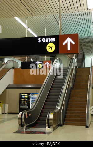 escalator, signs and arrow in the South Terminal Stock Photo