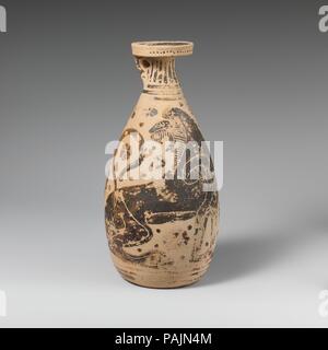 Terracotta alabastron (perfume vase). Culture: Greek, Corinthian. Dimensions: H. 8 1/8 in. (20.7 cm). Date: ca. 575-550 B.C..  Pair of heraldic seated lions. Museum: Metropolitan Museum of Art, New York, USA. Stock Photo