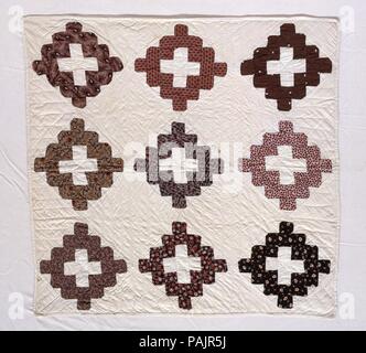 Doll Quilt, Chimney Sweep pattern. Culture: American. Dimensions: 26 x 24 3/4 in. (66 x 62.9 cm). Maker: Ella Mygatt Whittlesey (born ca. 1845). Date: 1852.  This small quilt has nine blocks in the Chimney Sweep pattern. The blocks are pieced of plain white woven cotton and calico printed in shades of brown, red, and orange. The backing is also of white cotton, while the edge binding is of a more tightly woven white cotton. The piece is completely hand stitched, and it is quilted in parallel lines in the plain areas and in a large diamond grid in the pieced blocks. Museum: Metropolitan Museum  Stock Photo