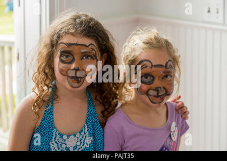 two young girls with face paint on their faces Stock Photo