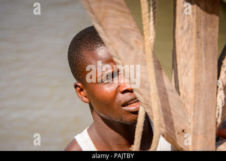 BANJUL, GAMBIA - MAR 14, 2013: Portrait of an unidentified Gambian man in Gambia, Mar 14, 2013. People of Gambia suffer of poverty due to the unstable Stock Photo