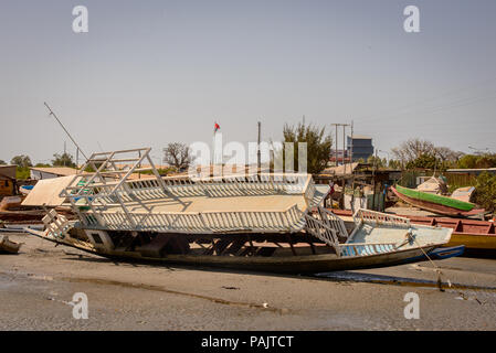 BANJUL, GAMBIA - MAR 14, 2013: Ship out of the water in Gambia, Mar 14, 2013. Major ethnic group in Gambia is the Mandinka - 42% Stock Photo