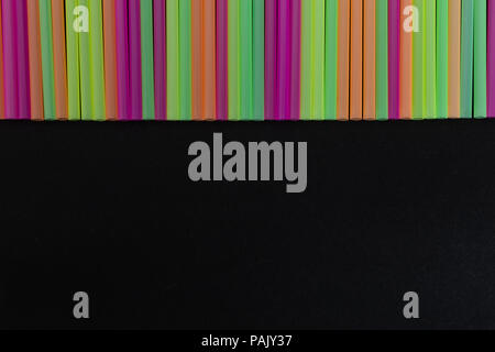 Line of decorative colorful straws design pattern as party decorative disposable drink beverage product concept isolated on whit background Stock Photo