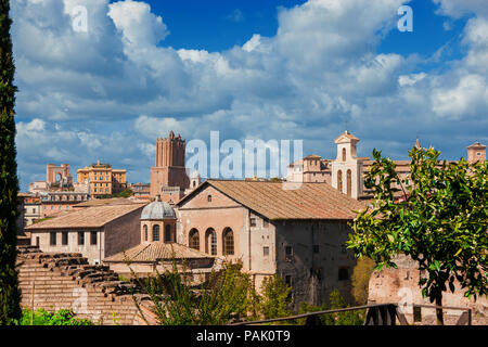 Rome historic center old skyline above Imperial Fora with medieval Tower of Militia, old churches and clouds, seen from Palatine Hill Stock Photo