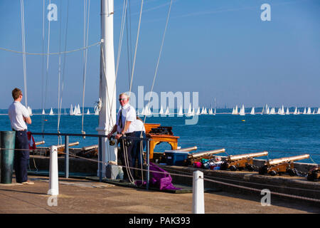 Race officers at the Royal Yacht Squadron in Cowes conduct the start of the 1,204 yachts competing in the 87th annual Round The Island Race. The world Stock Photo